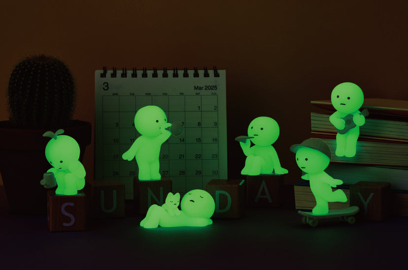 Glowing green figures in front of a calendar on a dark background