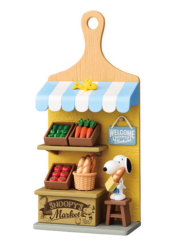 Model of a market stand with Snoopy and Woodstock, featuring a wooden paddle as the top.