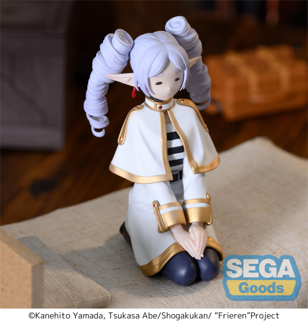 SEGA PM Perching Figure Frieren in seated pose with ringlet hairstyle, white mage outfit — official Frieren: Beyond Journey's End prize figure collectible