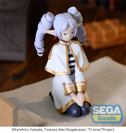 SEGA PM Perching Figure Frieren in seated pose with ringlet hairstyle, white mage outfit — official Frieren: Beyond Journey's End prize figure collectible