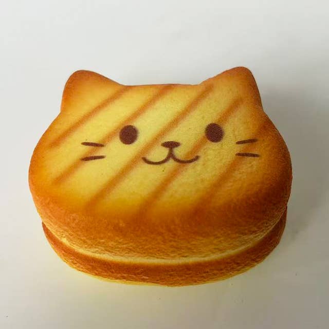 Nyang Nyang Cat Bread Squishy — slow-rising foam squishy cat bread stress relief toy, kawaii desk toy gift