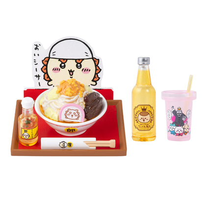 Set of Japanese-themed items including a bowl of food, drinks, and a cartoon character cutout on a white background.