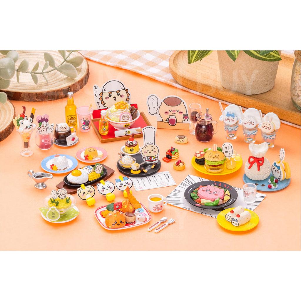 Set of miniature food and character figures on a table