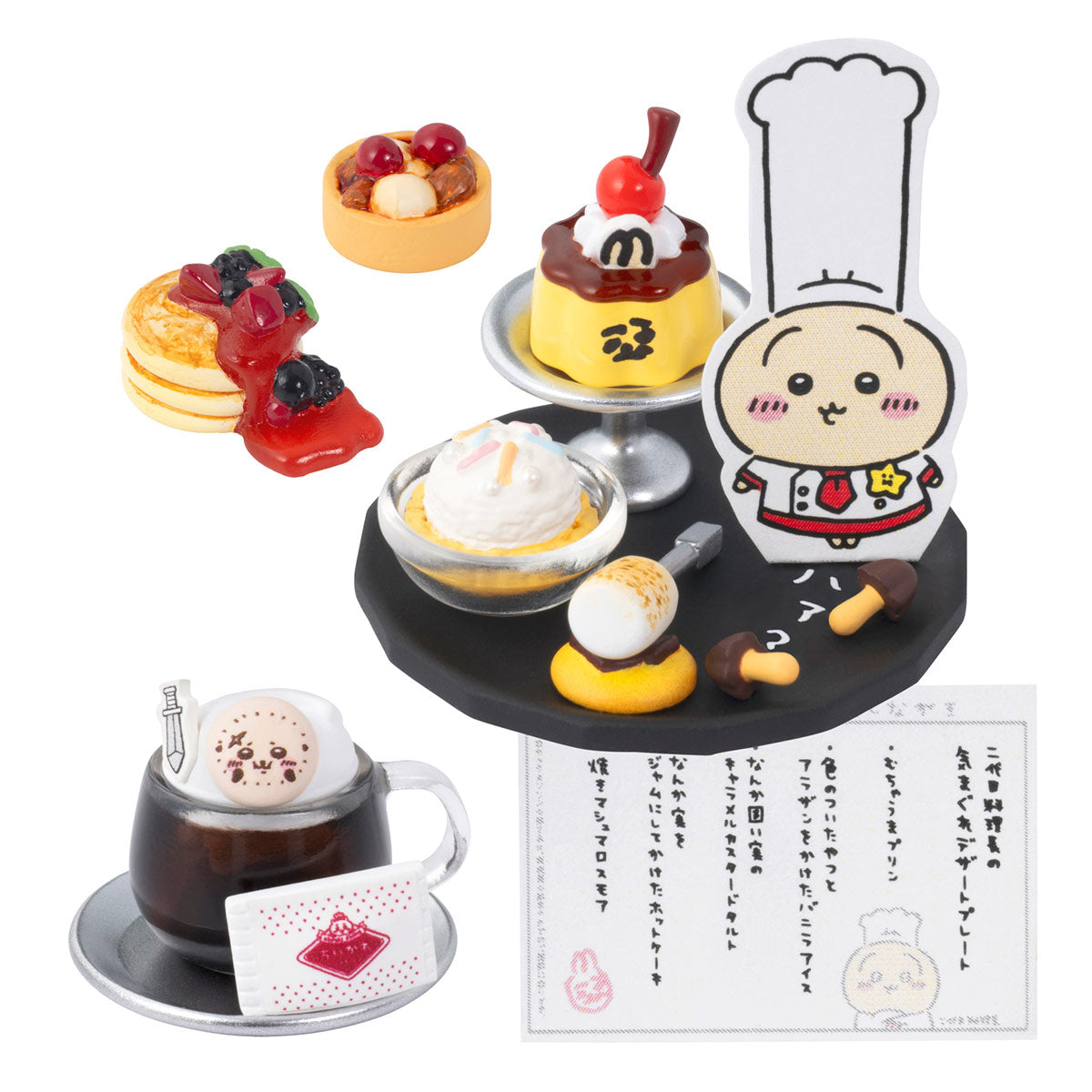 Set of miniature desserts and a character figurine on a white background