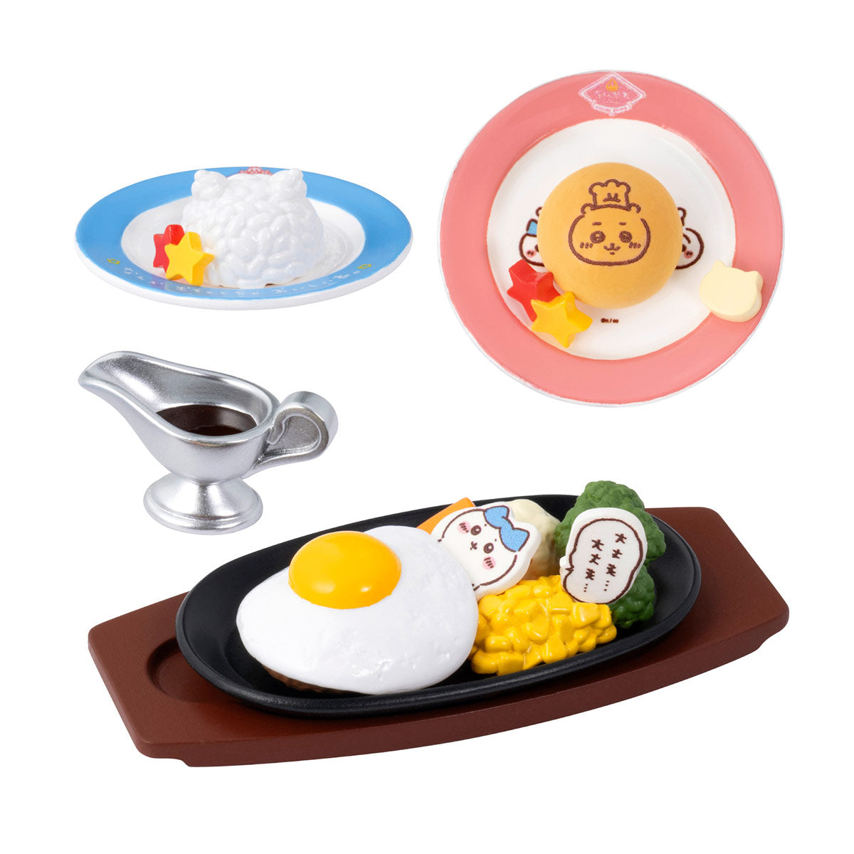 Set of toy food items including a plate with an egg, rice, and vegetables, a small sauceboat, and a pink plate with a cartoon character.