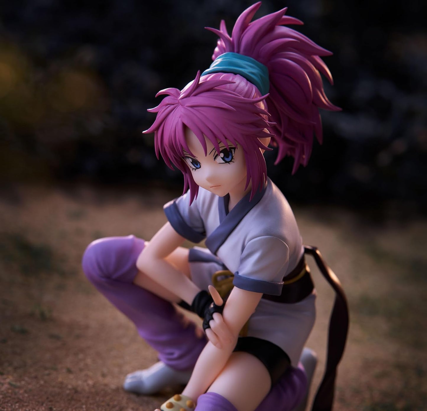 FuRyu Hunter x Hunter Machi Noodle Stopper figure with pink hair in a crouching pose on a dark background.