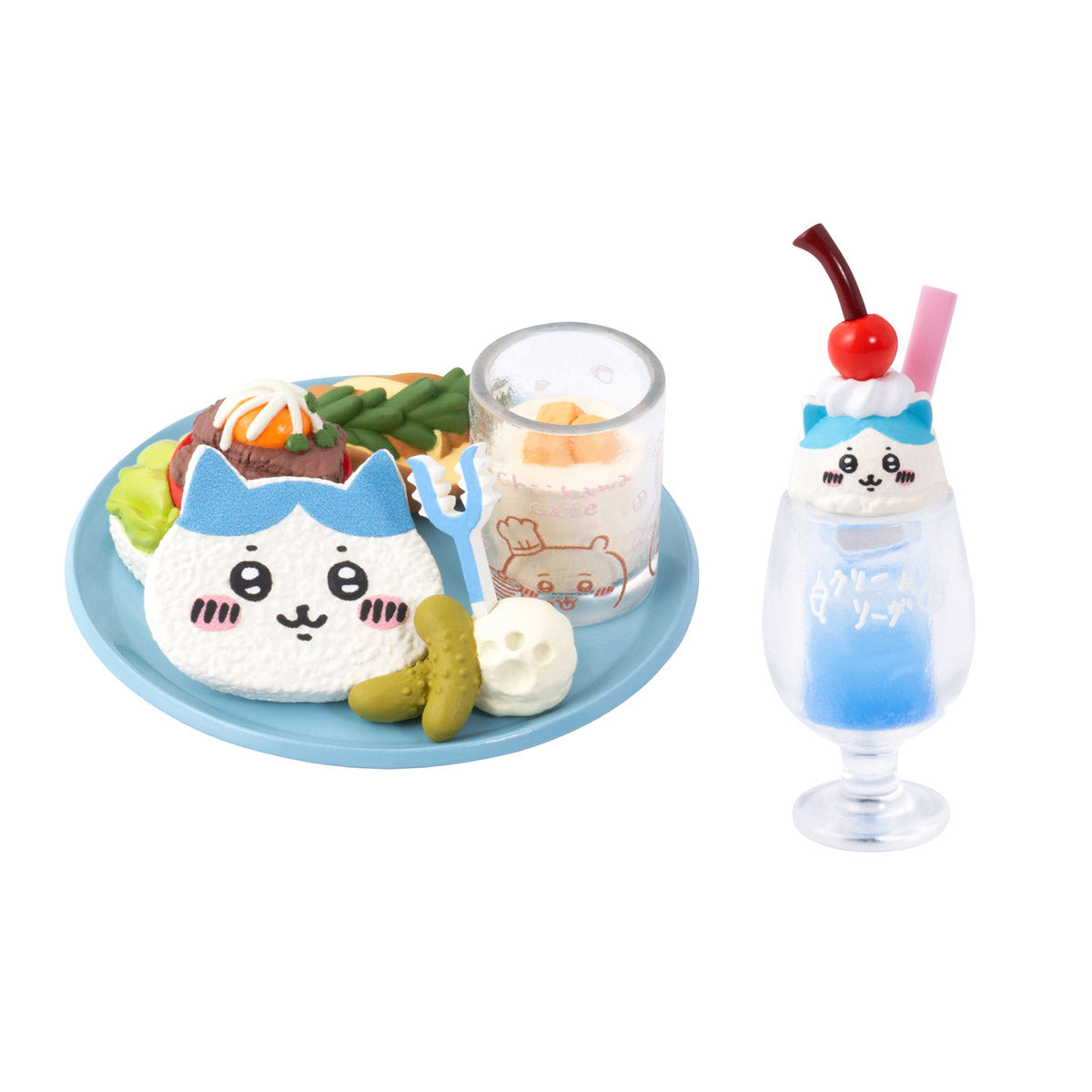Set of two plush toys resembling a rice ball with a face and a glass drink on a white background