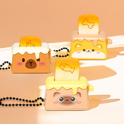 Bread Pops Up Toaster Keychain — miniature toaster bag charm with bread popping up, kawaii novelty keychain