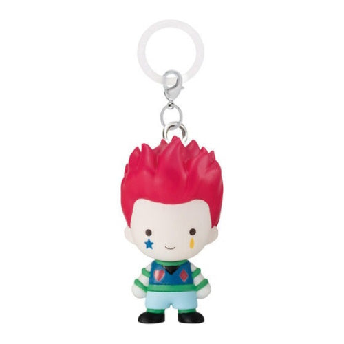 Keychain with a character having red hair and colorful outfit on a white background