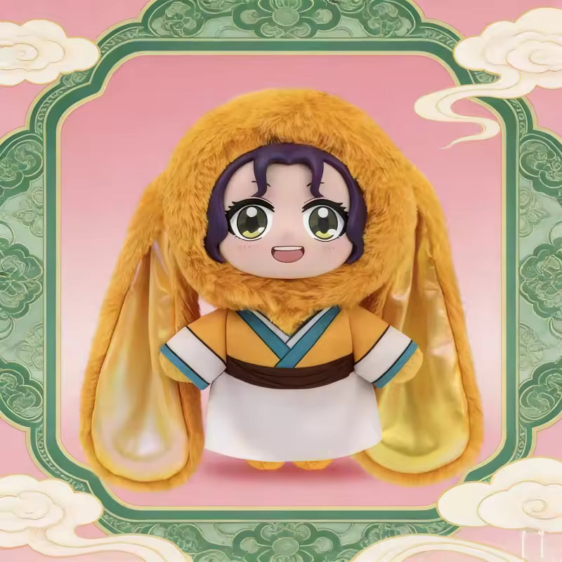 Plush toy with a character wearing a yellow outfit and fur hood on a decorative pink and green background.