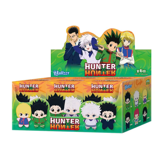 Hunter x Hunter plush keychain blind box display featuring chibi versions of Gon, Killua, Kurapika, Leorio, Hisoka, and Chrollo on a green and orange box.