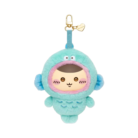 Official Chiikawa x Sanrio Characters Kiramekko plush keychain featuring Kurimanju wearing a teal Hangyodon costume with a gold heart charm and clasp.