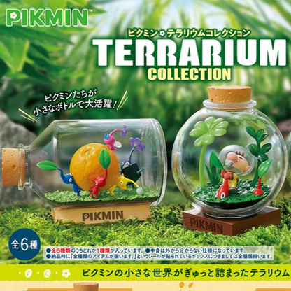 Pikmin terrarium collection with glass containers and miniature figures on a grassy background.