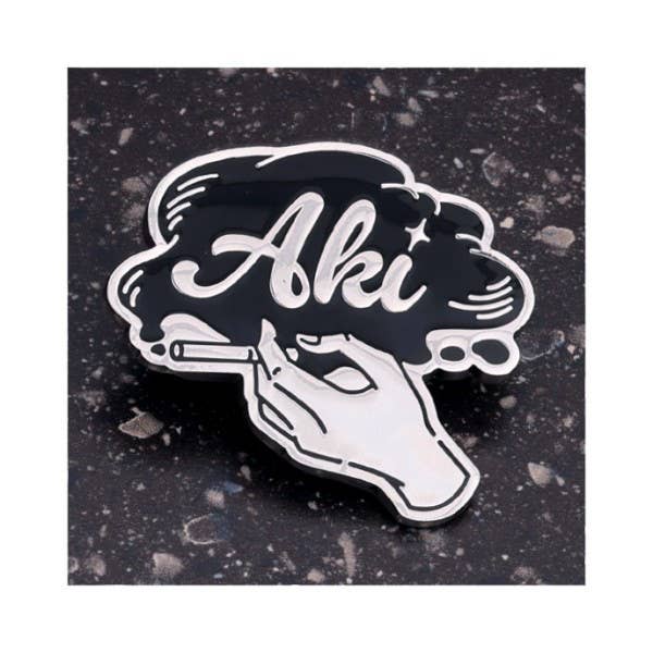 Chainsaw Man Reze Arc Motif Design Pins complete box — 10 black and silver metal pins featuring Denji, Reze, Makima, Aki, Power, Beam, Angel Devil, Chainsaw Man and Bomb