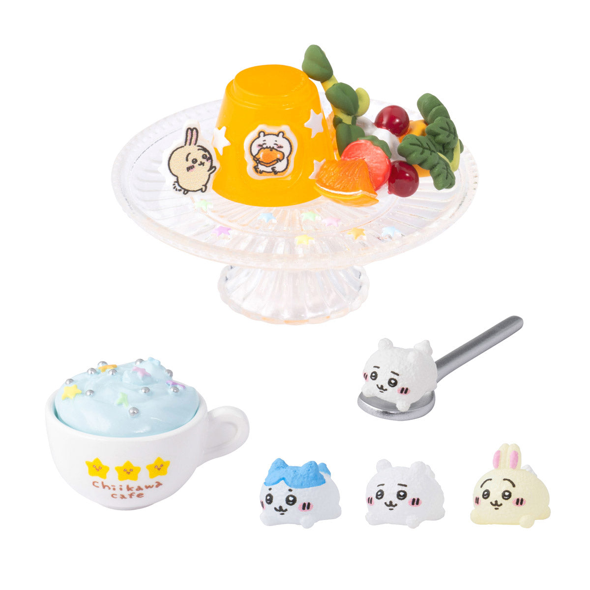 Set of cartoon-themed items including a cup, spoon, and small figures on a white background
