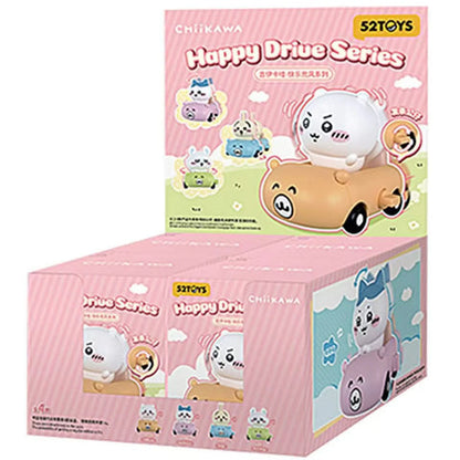 52TOYS Chiikawa Happy Drive Series blind box display showing Chiikawa, Hachiware, and Usagi driving colorful pull-back miniature cars with pink packaging.