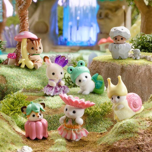 Sylvanian Families Baby Fairy Forest Friends blind bag featuring 8 adorable collectible baby figures dressed as fairies, frogs, flowers, and mushrooms. Each mystery pack includes one baby figure with a whimsical forest theme.