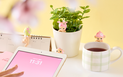 Sonny Angel Hippers Cherry Blossom Series blind box — 12 pink and green sakura-themed decorative mini figures with self-adhesive backing, official spring 2026 collectible