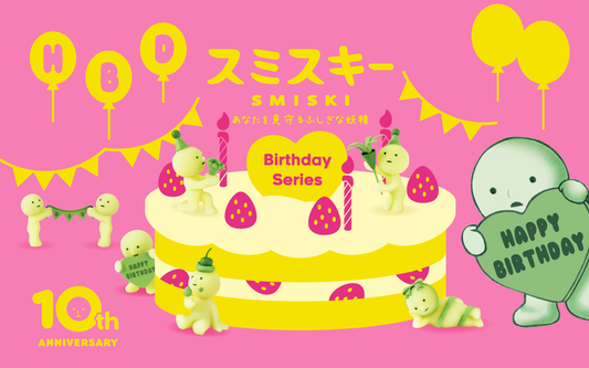 Smiski character with birthday cake and balloons on a pink background