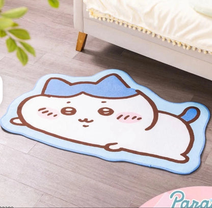 Chiikawa Parade lying down rug mat — 4 designs featuring Chiikawa (pink), Hachiware (blue), Usagi (yellow) and Momonga (purple), approx. 100cm with non-slip backing