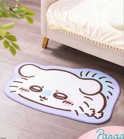 Chiikawa Parade lying down rug mat — 4 designs featuring Chiikawa (pink), Hachiware (blue), Usagi (yellow) and Momonga (purple), approx. 100cm with non-slip backing