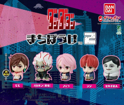 Lineup of 5 Bandai Dandadan Machiboke 2 Gashapon figures including Momo, Okarun, Aira, Jiji, and a Serpoian sitting in waiting poses.